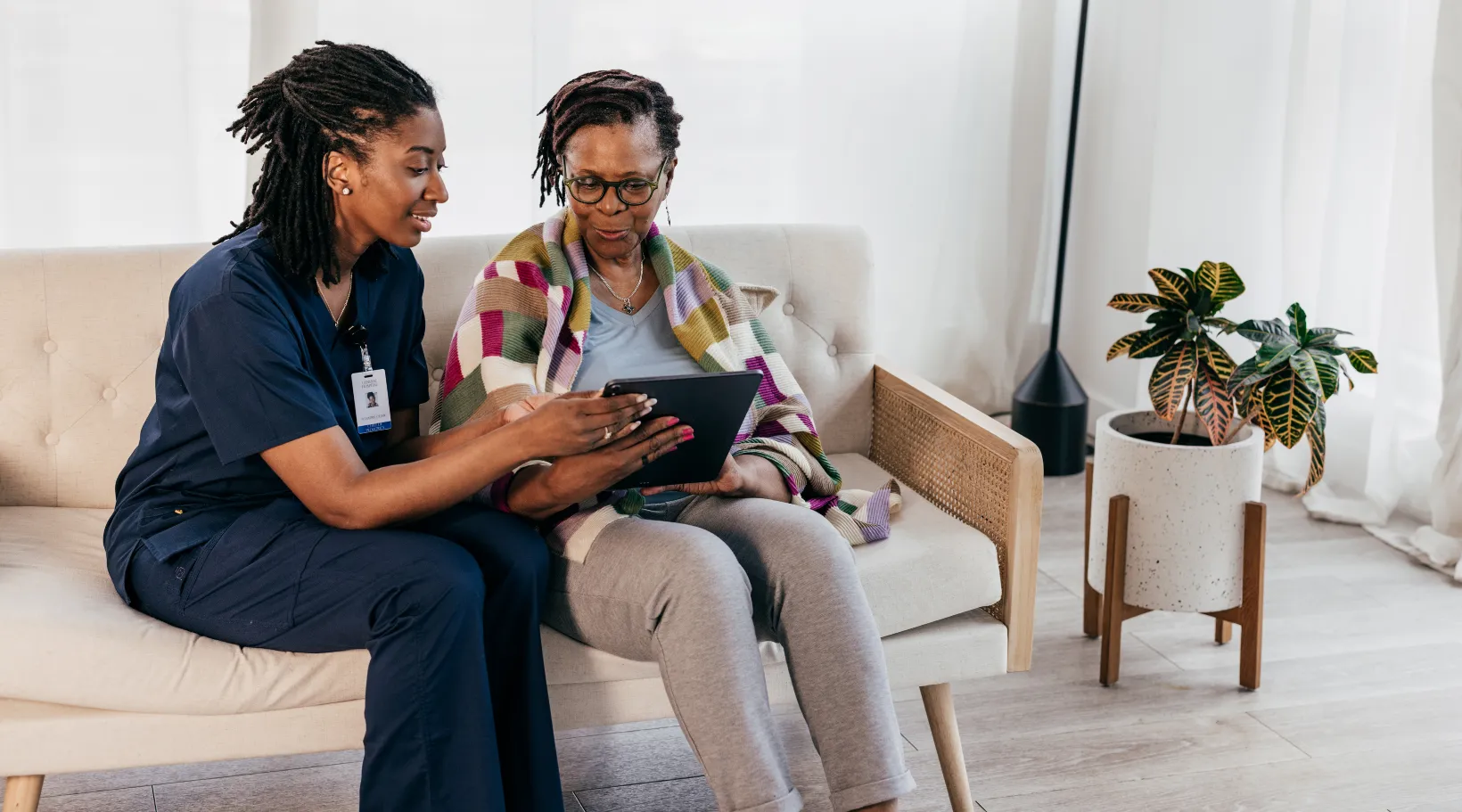 Caregiver managing orders using Walmart+ Support Program on tablet