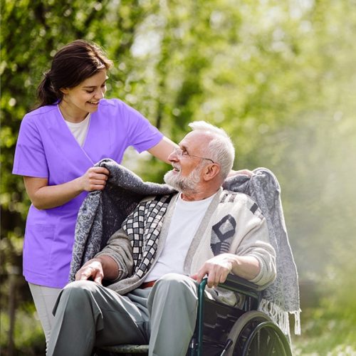 Veterans home health care caregiver assisting senior Veteran at home